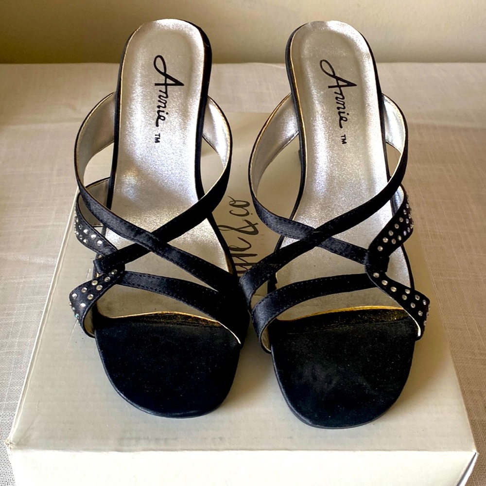 Never worn open toe slip on heels. Size 8.